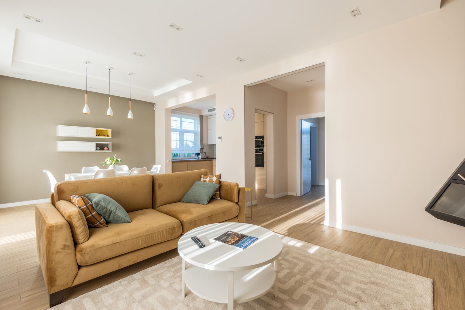 Sunlit open-plan living and dining space — stock interior photo